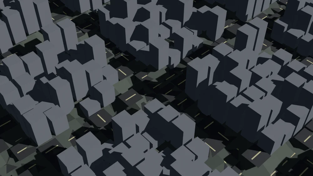 起伏のついた地面の上に建物と道路が乗っている